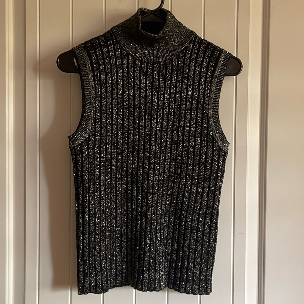 Calvin Klein shimmering sleeveless top. Looks brand new. Very versatile piece.